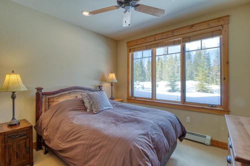 a bedroom with a bed and a large window at Settler's Creek 6524 in Keystone