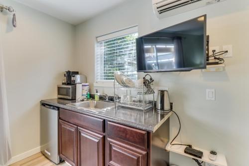 a kitchen with a sink and a microwave at Mercer Island- Mt Saint Helens Room in Mercer Island