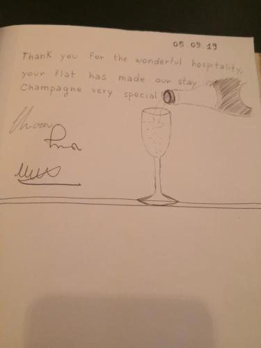 a piece of paper with a drawing of a wine glass at Groom Epernay - Jacuzzi & Champagne in Épernay