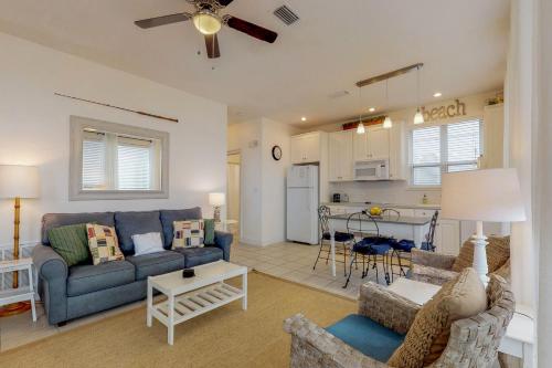 a living room with a couch and a table at Destiny Beach Villa in Destin