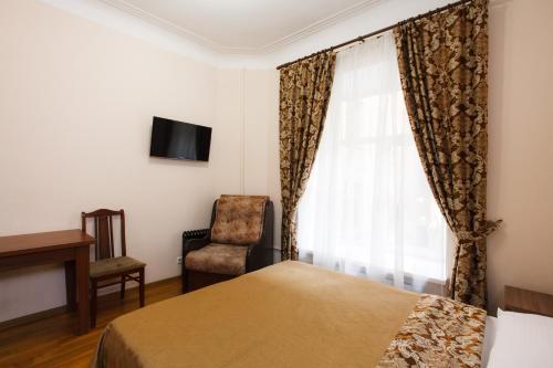 Cama ou camas em um quarto em Prestige Apartments na Vasilievskom