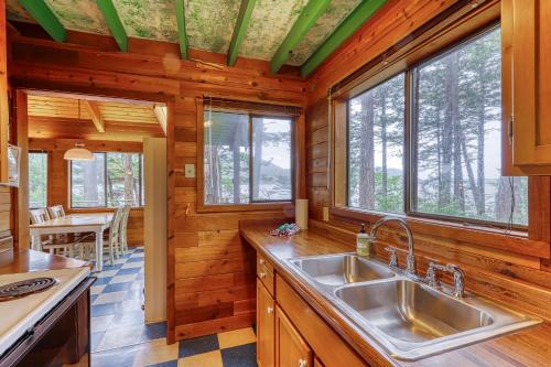 a kitchen with a sink and some windows at Lohman Lookout in Eastsound