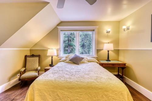 a bedroom with a large bed and a window at 6 Bed 4 Bath Vacation home in Eastsound in Eastsound