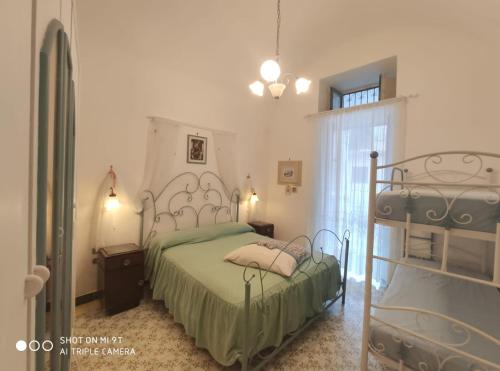 La Casa di Rita tesisinde bir odada yatak veya yataklar