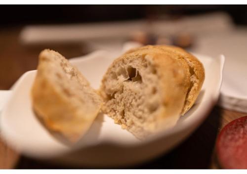 a white plate with a half eaten pastry on it at Phi Hotel Canalgrande in Modena