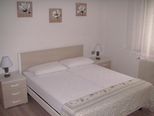 Krevet ili kreveti u jedinici u objektu Casa Ferrari Monica CIPAT 22032
