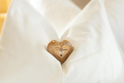 a heart shaped button on a white dress shirt at Hotel Zimmerbräu in St. Wolfgang