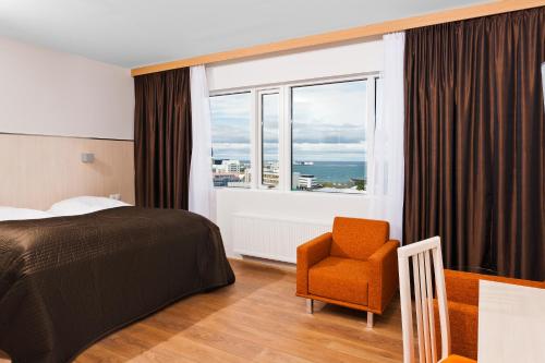 Säng eller sängar i ett rum på Hotel Klettur