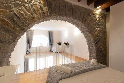 A bed or beds in a room at Center Loft Apartment