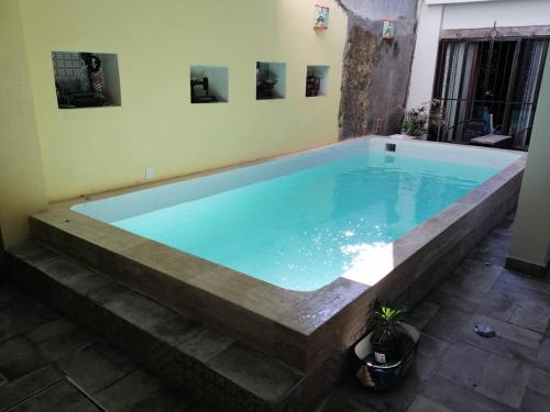 a large swimming pool in the middle of a room at Aguacate Suites in Mazatlán