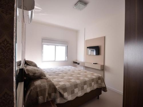 Ліжко або ліжка в номері 1034 - Apartamento para locação em Bombinhas