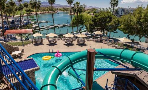 a pool at a resort with a water slide at London Bridge Resort in Lake Havasu City