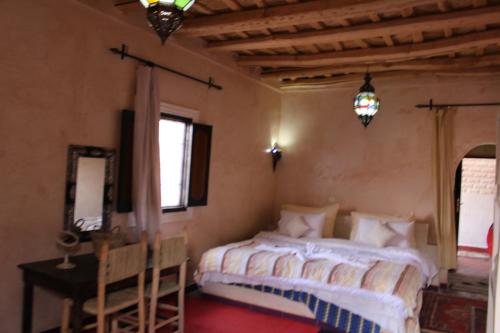 Una cama o camas en una habitación de Riad Gabsi Dades