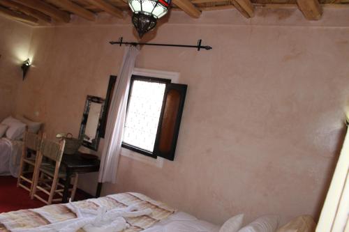 Una cama o camas en una habitación de Riad Gabsi Dades