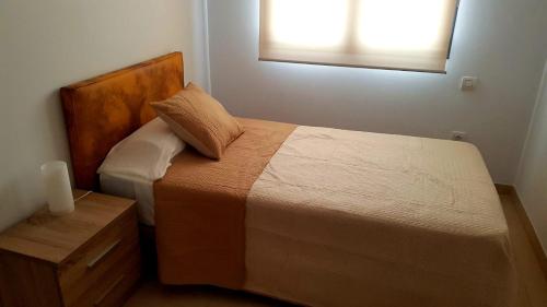 Posteľ alebo postele v izbe v ubytovaní Edificio Bentejui 1