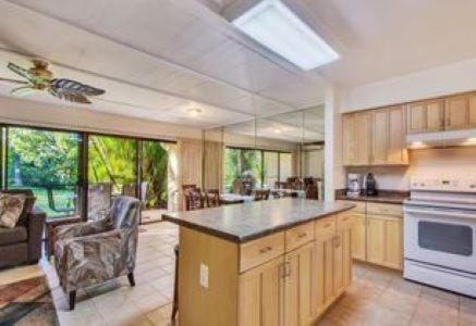 a large kitchen with an island in the middle at KOA Resort 5D in Kihei