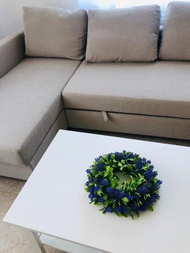 a living room with a couch and a white coffee table at Tihany Levendula Villa in Tihany