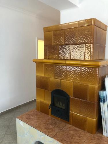 a brick fireplace in the middle of a room at Tihany Levendula Villa in Tihany