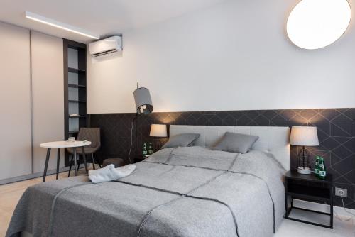 Posteľ alebo postele v izbe v ubytovaní Apartament Silesian Vip Gliwice