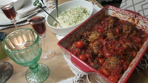 a table with a dish of food and a bowl of rice at The Place Guesthouse Parys in Parys
