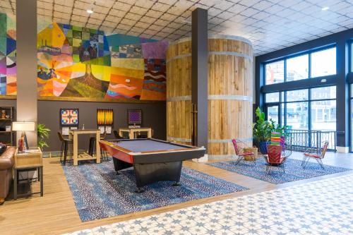 
a living room filled with lots of furniture at HI New Orleans Hostel in New Orleans
