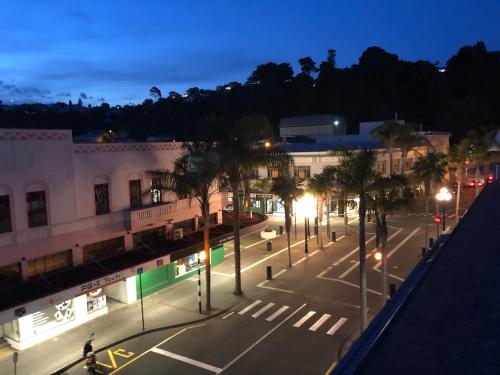 an empty city street at night with street lights at Laneway Apartments - The Residence in Napier