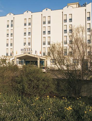 a large building with a hotel in front of it at Hotel Persico's in San Giovanni in Persiceto