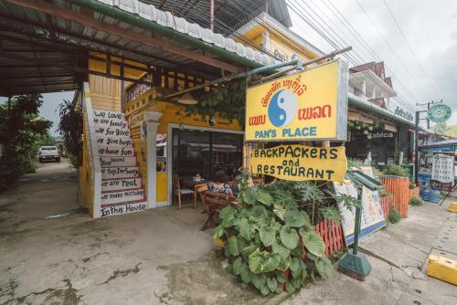a store with a bunch of vegetables in front of it at Pan's Place in Vang Vieng