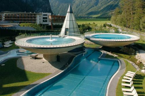 two large swimming pools in a resort at Haus Romantika in Umhausen