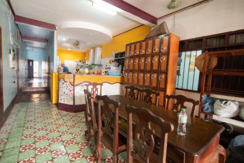 a dining room with a table and chairs at Pan's Place in Vang Vieng