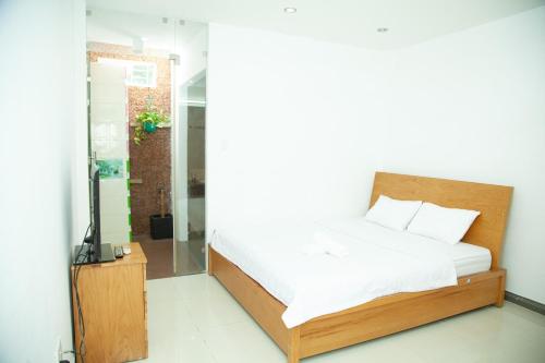 Ένα ή περισσότερα κρεβάτια σε δωμάτιο στο Homestay Vũng Tàu