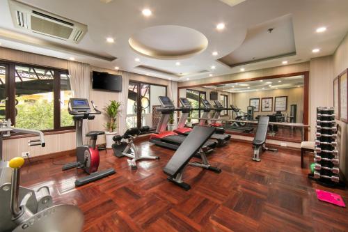 a gym with treadmills and cardio equipment in a room at Thien Thai Hotel & Spa in Hanoi