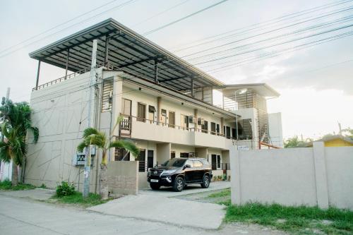a car parked in front of a house at Contemporary cozy 6- 2BR Apartment in Davao City