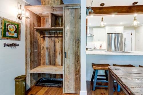 a kitchen and dining room with a reclaimed wood wall at Dollar Meadows 1372 in Sun Valley
