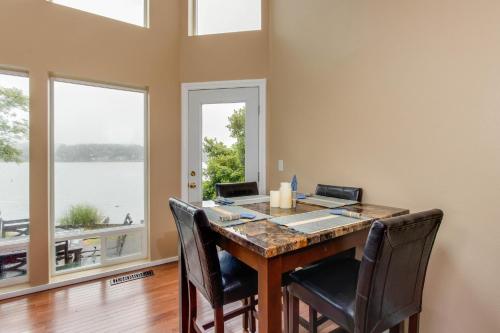 a home office with a desk with chairs and windows at Lake House PlayLand in Lincoln City