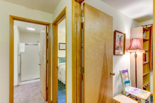a hallway with a door leading to a bedroom at The Little Brown House MCA #705 in Manzanita