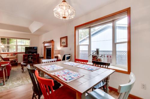 a dining room with a wooden table and chairs at Edgewood Getaway in Seaside