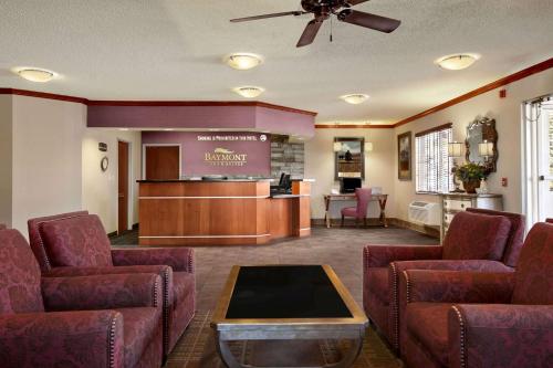 a waiting room with chairs and a bar in a hospital at Baymont by Wyndham Golden/Red Rocks in Lakewood