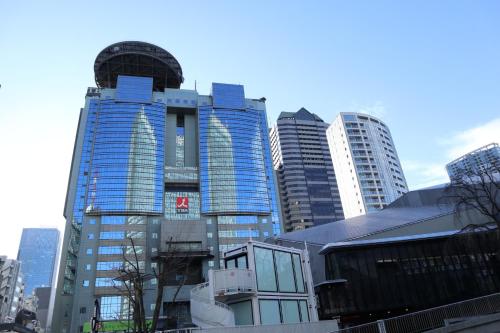 a group of tall buildings in a city at Best Western Hotel Fino Tokyo Akasaka in Tokyo