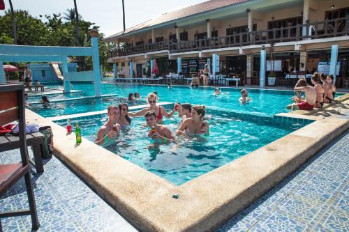 a group of people in a swimming pool at Paradise Bungalows in Haad Rin