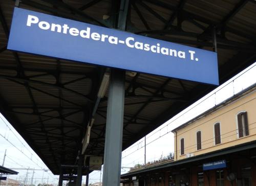 a sign at a train station that reads ponentoria costanza t at Hotel La Pace in Pontedera