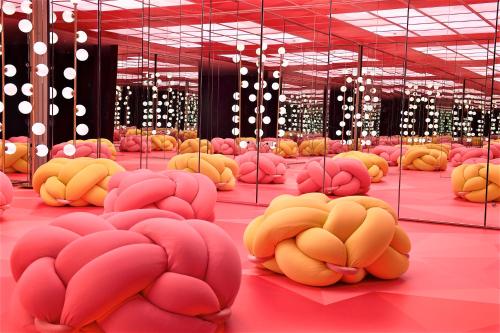 a room filled with lots of pink and yellow brains at Just Sleep - Ximending in Taipei