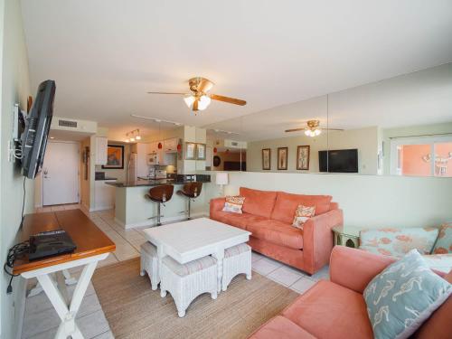 a living room with a couch and a table at Relaxing Condo, Great Location, 3 Minute Walk To The Beach Condo in South Padre Island