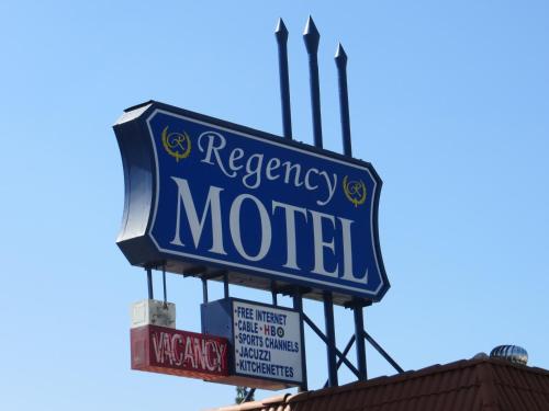a sign for a motel on top of a building at Regency Motel in Brea