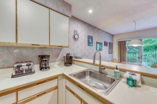 a kitchen with a sink and a window at The Woods: Townhouse-F3 in Killington