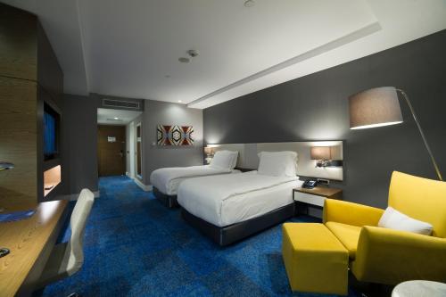Letto o letti in una camera di Radisson Blu Hotel, Kayseri