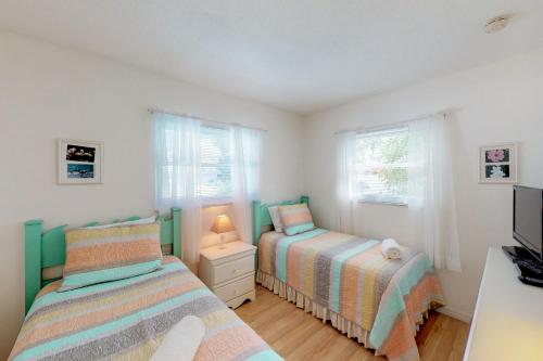 Postel nebo postele na pokoji v ubytování Blue Wave Villa East