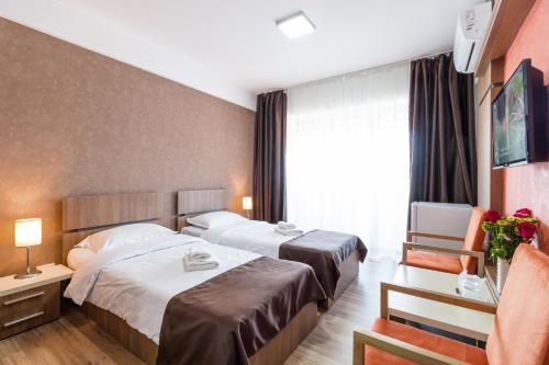 Postel nebo postele na pokoji v ubytování HB Brilliant