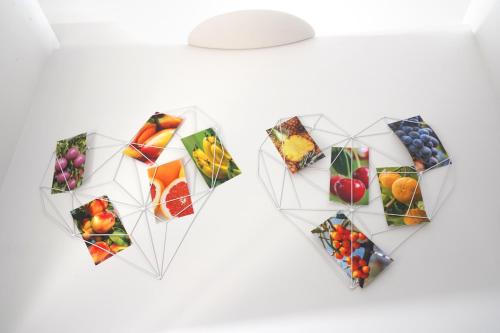 a heart shaped collage of different fruits and vegetables at Rosita Luxury Apartments in Apricena