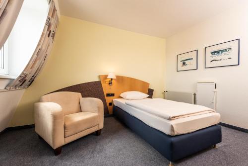 ARVENA Kongress Hotel - Hotel in der Wagnerstadt tesisinde bir odada yatak veya yataklar